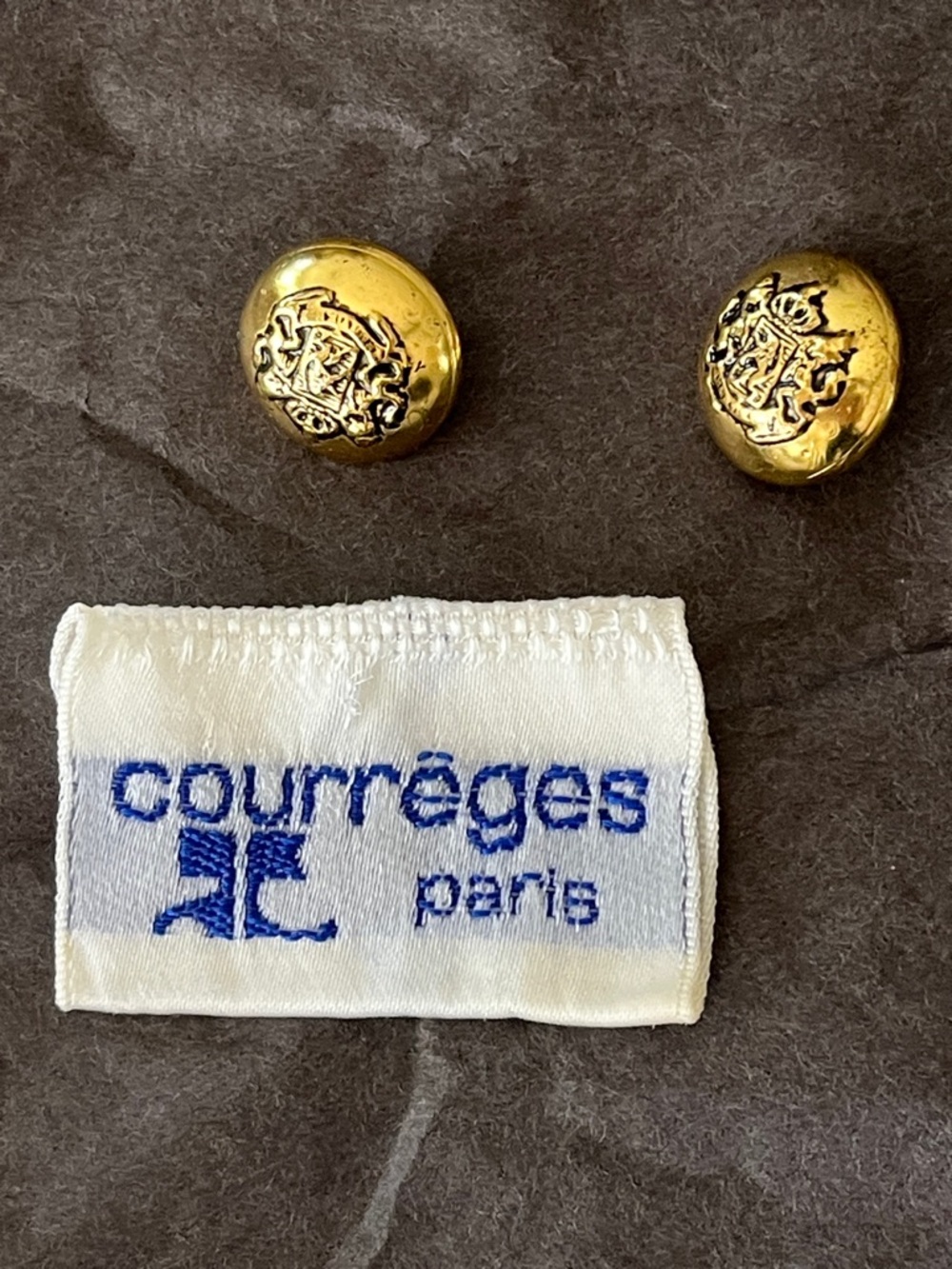 Courreges tag and two buttons